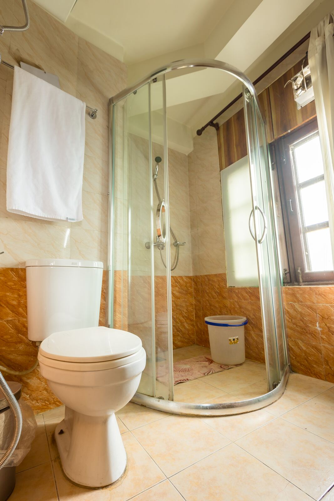 The bathroom, with a shower enclosure.